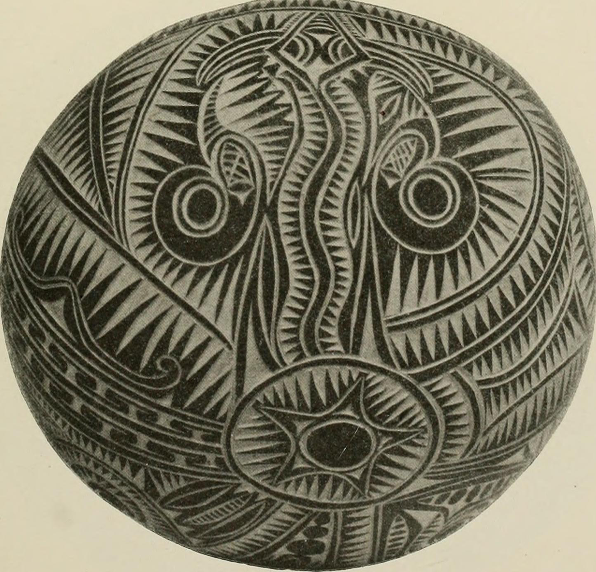 A photograph of a carved coconut shell.